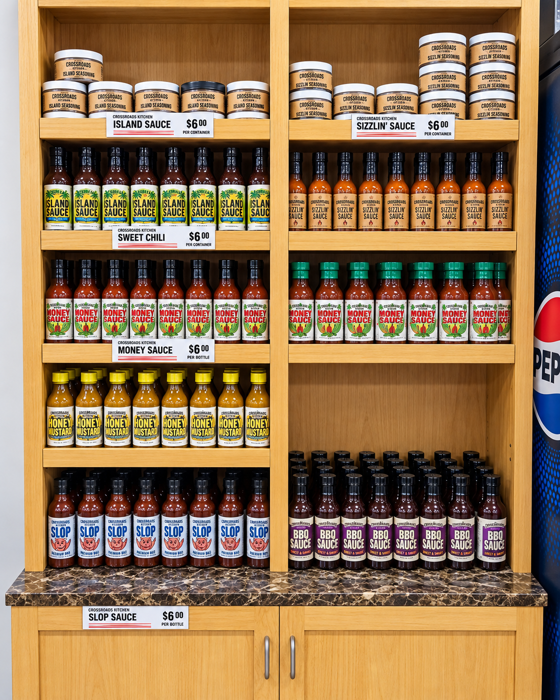 Big Daddy's house-made sauce collection on display — Island Sauce, Sizzlin' Sauce, Money Sauce, Honey Mustard, Slop Sauce, and BBQ Sauce